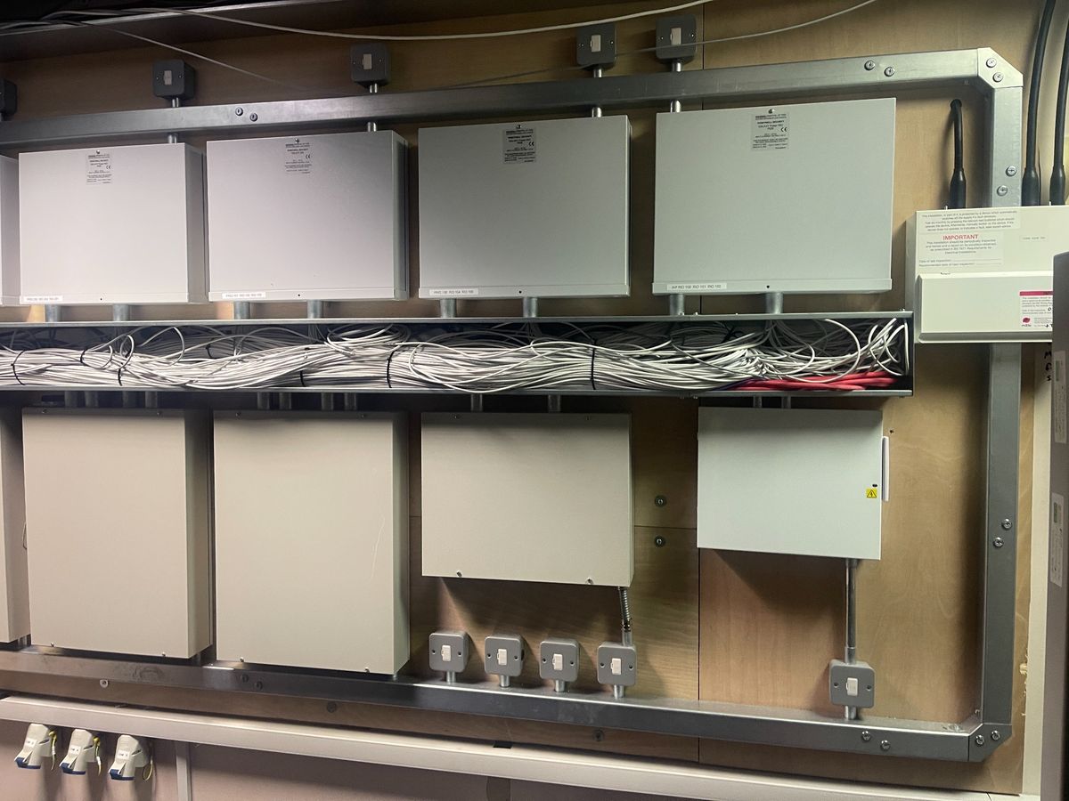 Bank of commercial distribution boards with labelled containment