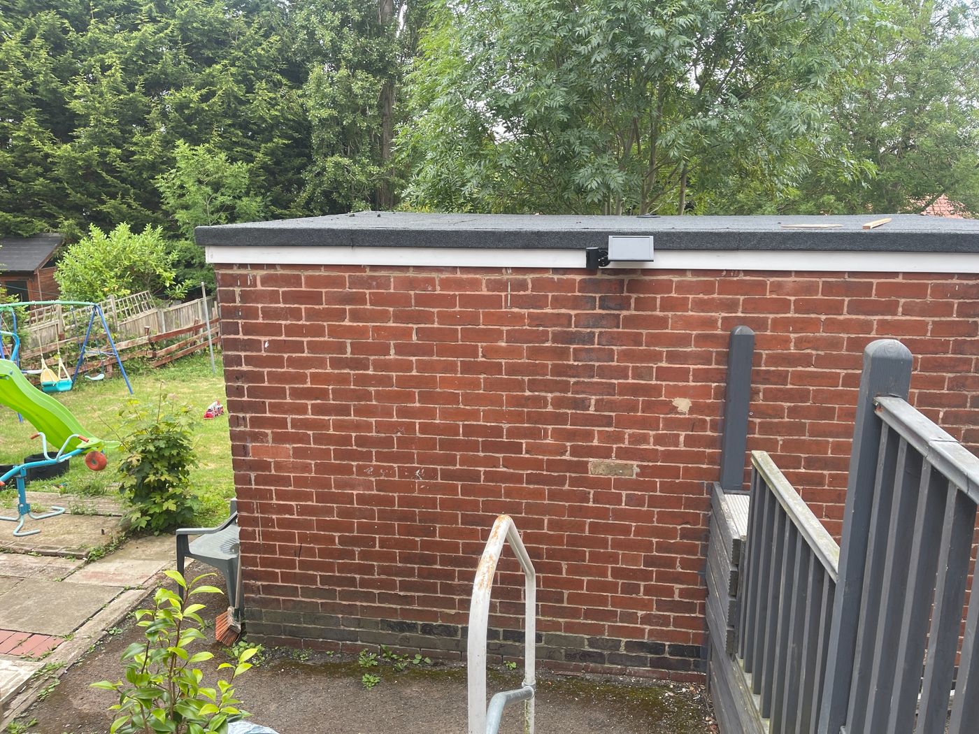 Exterior security camera covering the rear of a building